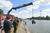 Beringen - Bromfiets in het kanaal