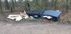 Lommel - Afval gedumpt op parking bij zandgroeve