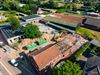 Oudsbergen - Afbraak oude schoolgebouw in Ellikom begonnen
